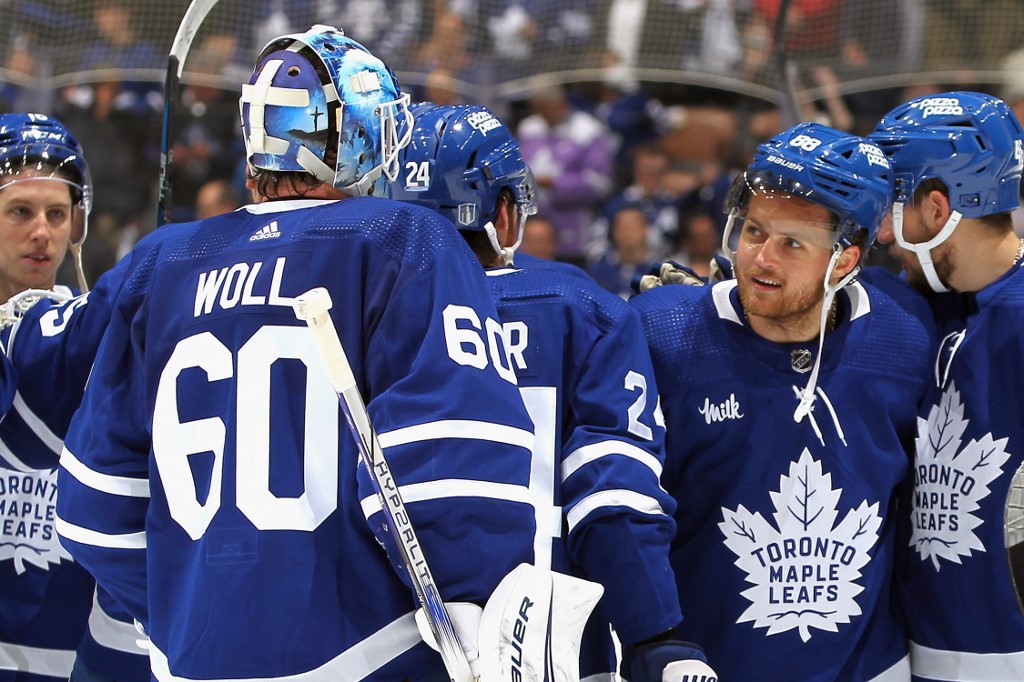 Joseph Woll and William Nylander celebrate a win against the Boston Bruins in Game 6 as we offer our best Toronto Maple Leafs vs. Boston Bruins Game 7 predictions.