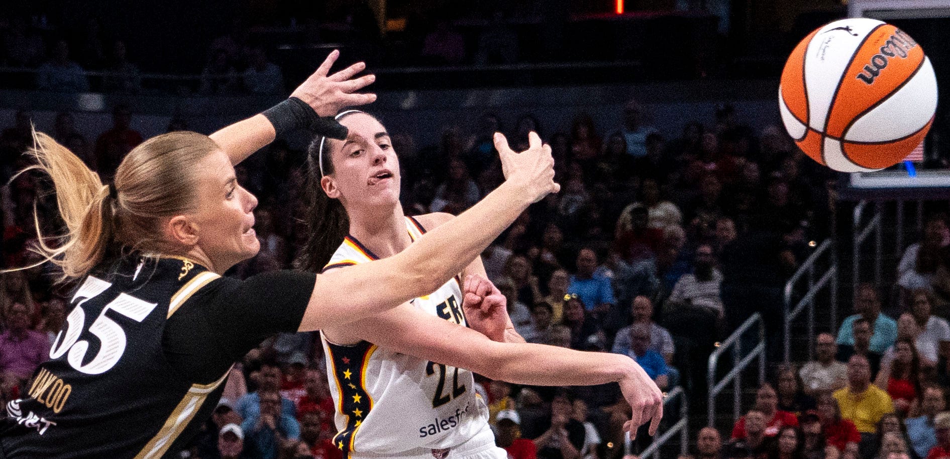 Indiana Fever guard Caitlin Clark (22) passes the ball as we offer our Mystics vs. Fever prediction and expert picks for Wednesday's WNBA matchup at Gainbridge Fieldhouse in Indianapolis.