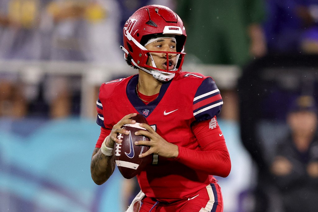 Kaidon Salter #7 of the Liberty Flames looks to pass against the Toledo Rockets as we make our New Mexico State vs. Liberty picks and predictions for the Conference USA Championship.