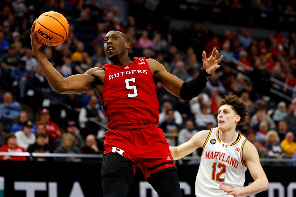 Aundre Hyatt #5 of the Rutgers Scarlet Knights receives a pass as we look at New Jersey's plans to ban college player prop betting