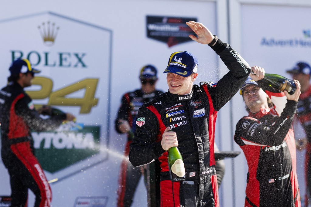 Josef Newgarden is sprayed with champagne by Colton Herta in victory lane after the Rolex 24 at Daytona International Speedway as we dive into our best Indy 500 prop picks for Sunday's marquee race.