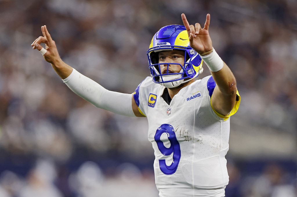 Matthew Stafford #9 of the Los Angeles Rams signals for a two-point conversion  we make our NFL Week 15 parlay predictions.