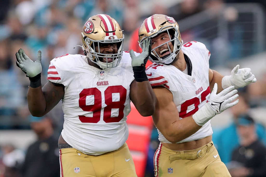 Nick Bosa of the San Francisco 49ers celebrates a sack with Javon Hargrave of the San Francisco 49ers during the third quarter against the Jacksonville Jaguars as we look at our Super Bowl 2024 parlay.