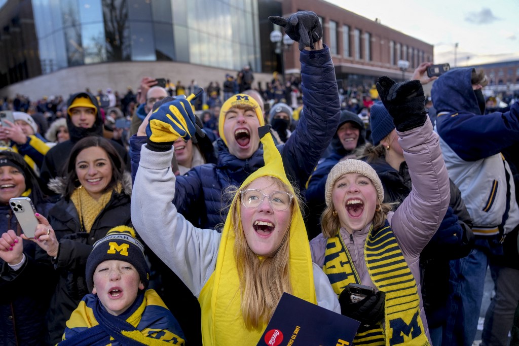 Fans cheer during the Michigan Wolverines football National Championship parade on Jan. 13 as we look at Caesars purchasing Wynn's operating rights in Michigan.