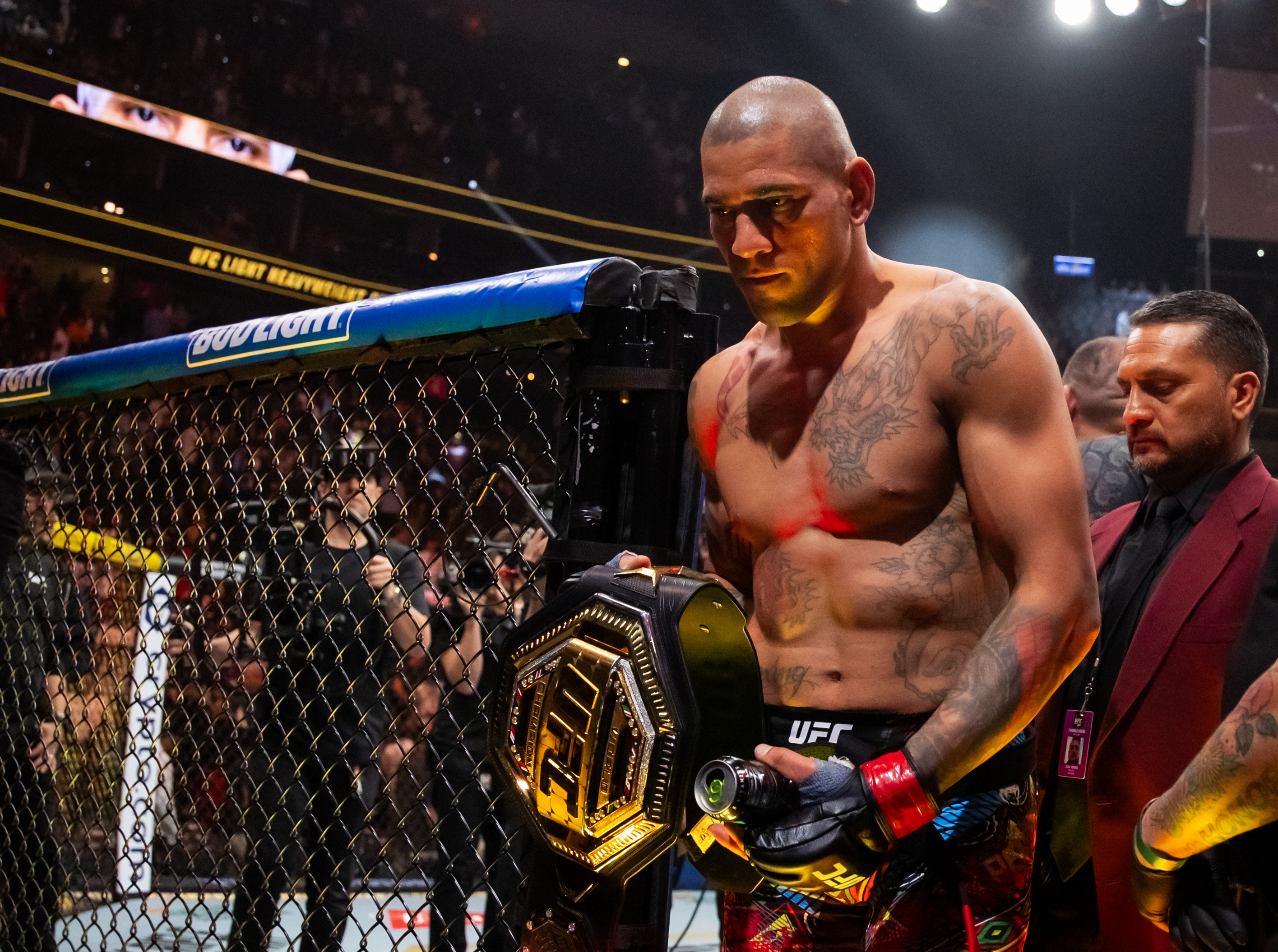 Alex Pereira celebrates with the championship belt as we look at the full UFC 303 card betting odds & lines.