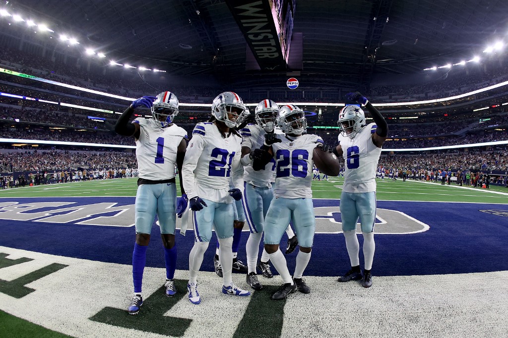DaRon Bland #26 of the Dallas Cowboys celebrates with teammates after an interception as we look at our Week 11 parlay picks.