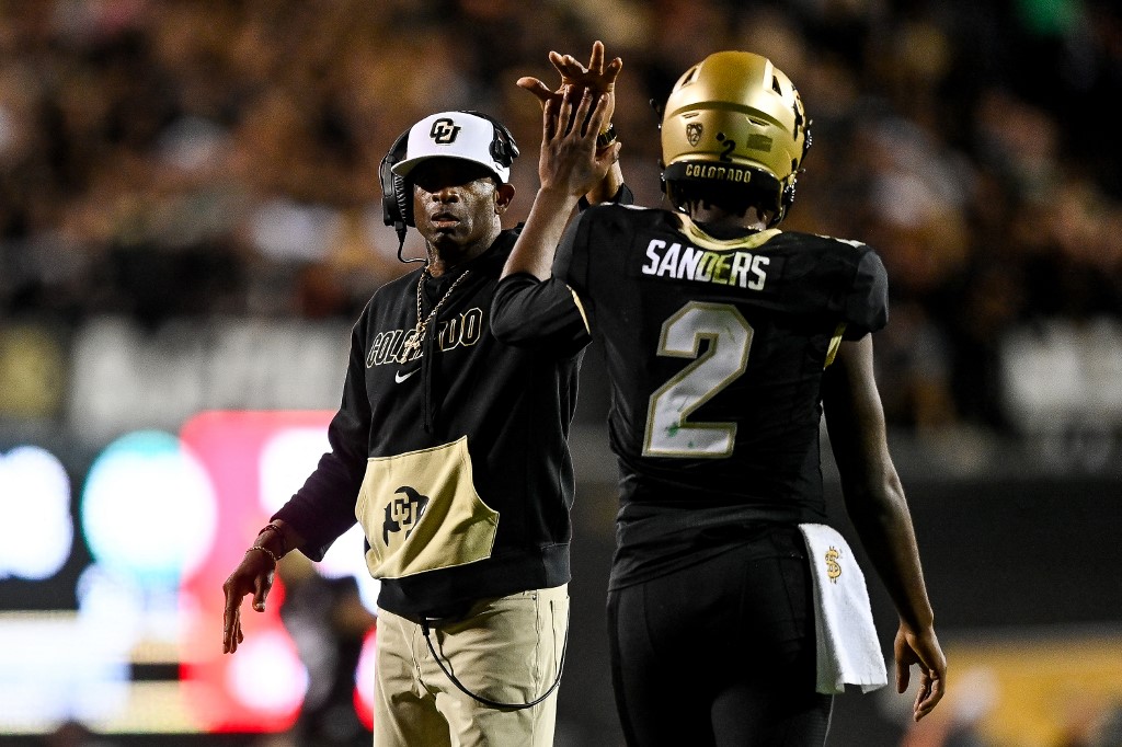 Head coach Deion Sanders of the Colorado Buffaloes celebrates as we look at Colorado's win total for 2024.