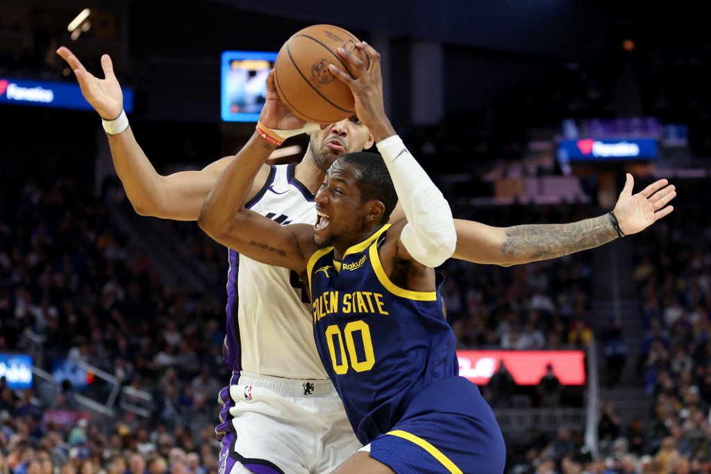 Jonathan Kuminga of the Golden State Warriors is guarded by the Sacramento Kings as we share our best 76ers vs. Warriors player props.