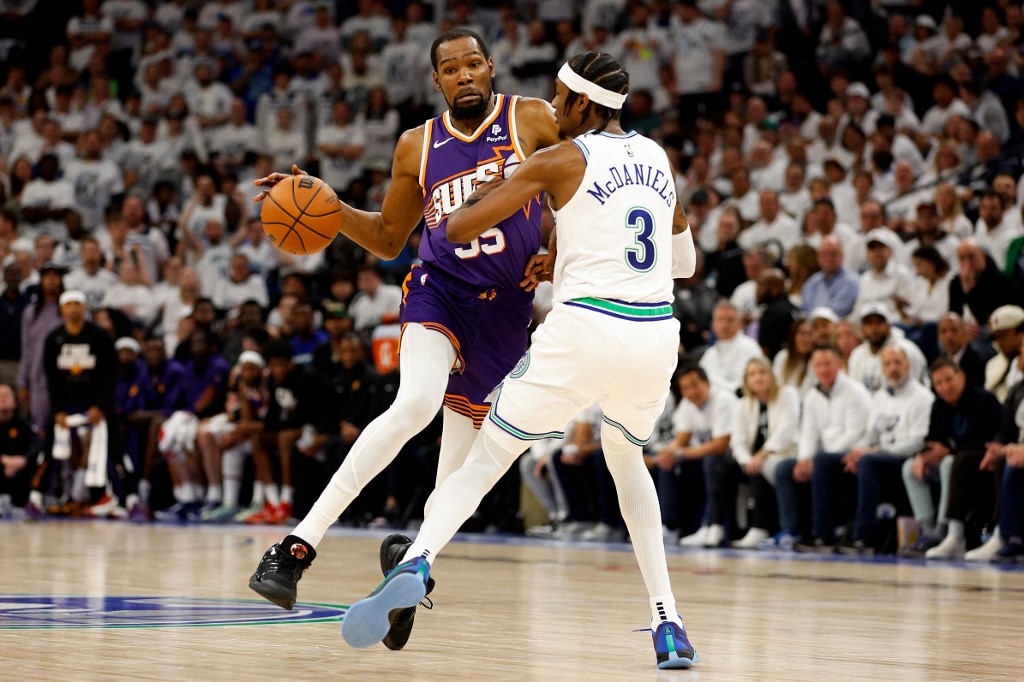 Kevin Durant (35) of the Phoenix Suns drives to the basket against Jaden McDaniels (3) of the Minnesota Timberwolves, as we offer our best Timberwolves vs. Suns player props for Game 3 on Friday.