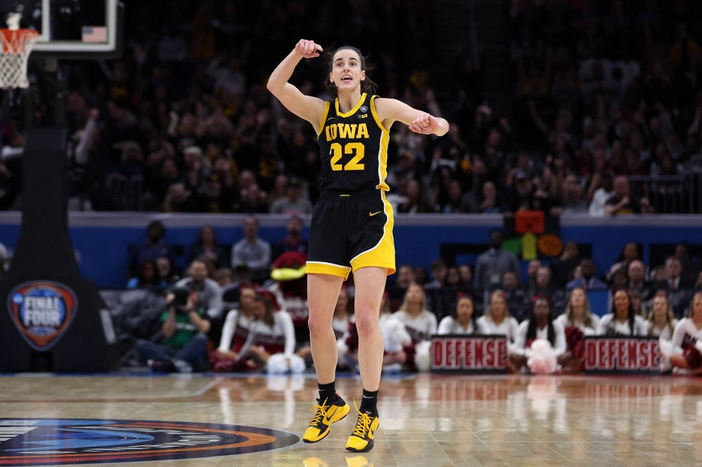 Caitlin Clark of the Iowa Hawkeyes reacts during the 2024 NCAA Women's Basketball Tournament National Championship game against the South Carolina Gamecocks. After being the favorite by the 2024 Women's Wooden Award odds, Clark won the award again.