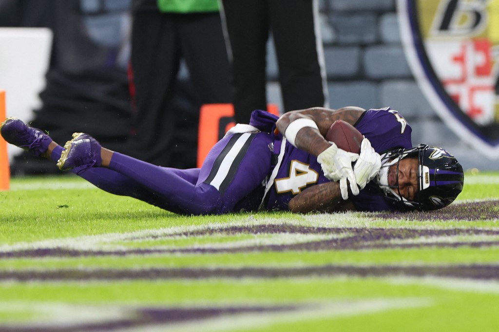Zay Flowers of the Baltimore Ravens scores a touchdown ahead of our Week 15 NFL predictions for Ravens vs. Jaguars