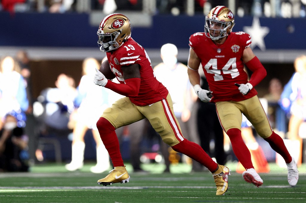Deebo Samuel of the San Francisco 49ers carries the ball against the Dallas Cowboys, and we offer our top Deebo Samuel player props based on the best NFL odds.