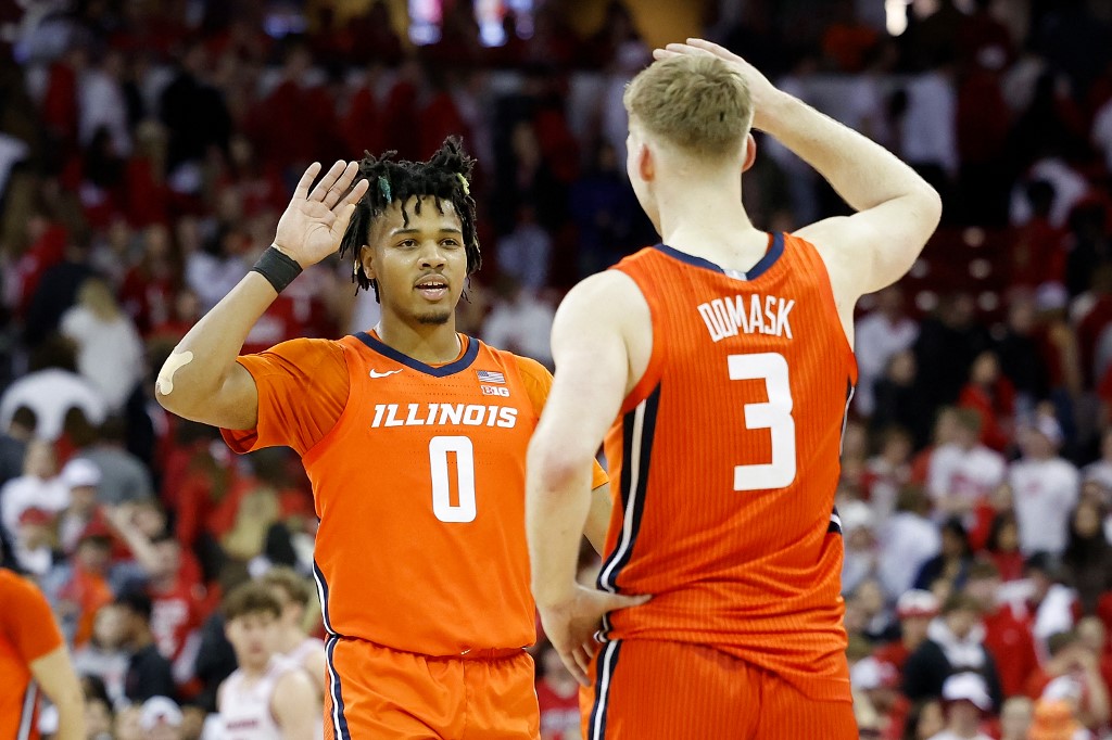 Terrence Shannon Jr. of the Illinois Fighting Illini congratulates Marcus Domask in the final seconds of the win over the Wisconsin Badgers. Illinois had the second shortest odds by the Big Ten Tournament odds 2024.
