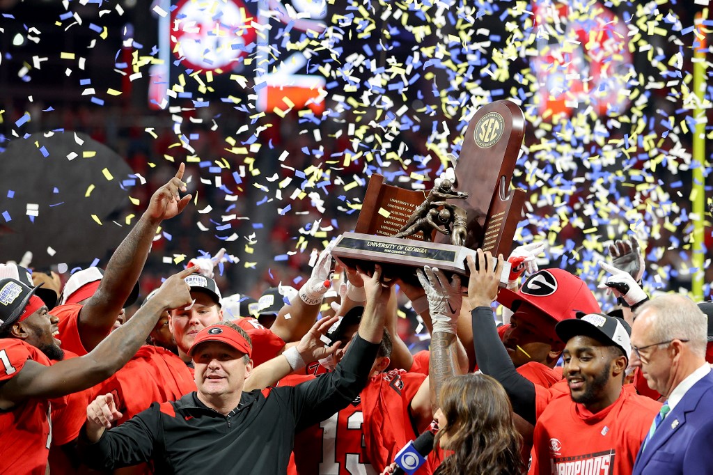 Head coach Kirby Smart of the Georgia Bulldogs celebrate with the trophy as we round up our top college football Week 14 predictions