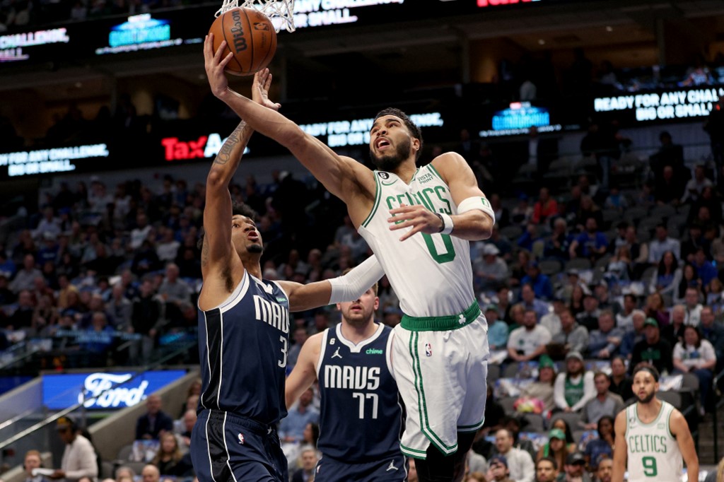 Jayson Tatum of the Boston Celtics drives to the basket against Jaden Hardy and Luka Doncic of the Dallas Mavericks in the second half at American Airlines Center. We're backing Tatum in our Mavericks vs. Celtics Parlay.