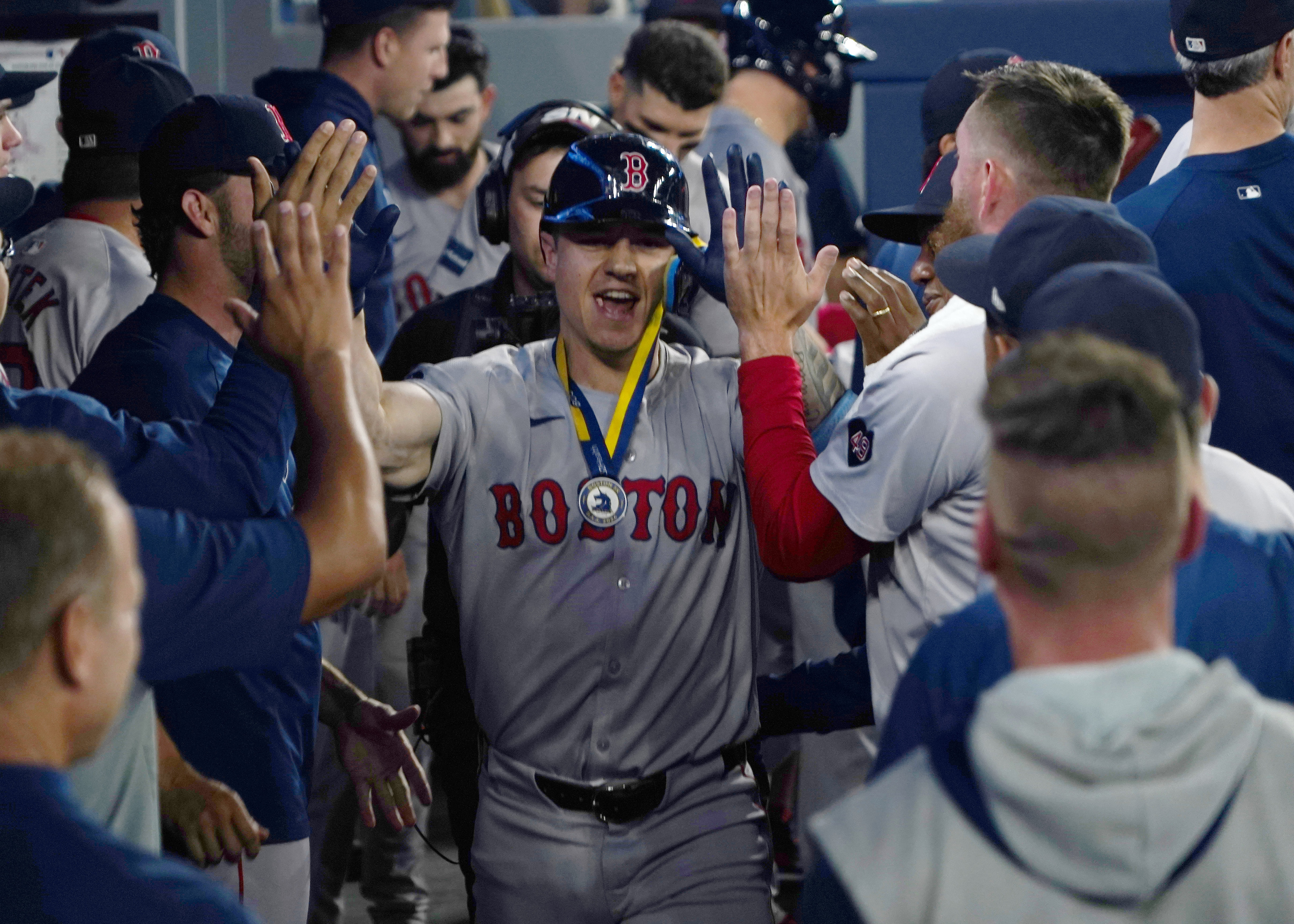 Boston Red Sox left fielder Tyler O'Neill gets congratulated after his solo home run against the Toronto Blue Jays during the eighth inning at Rogers Centre as we look at our Blue Jays vs. Red Sox player props.