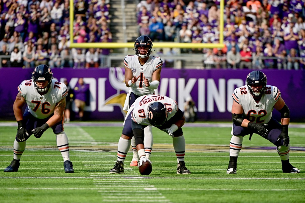 Justin Fields of the Chicago Bears lines up against the Minnesota Vikings during the first half at U.S. Bank Stadium on October 09, 2022 in Minneapolis, Minnesota.