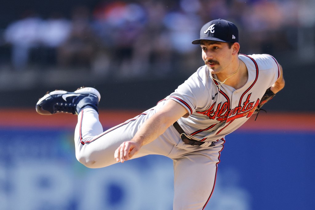 Spencer Strider #65 of the Atlanta Braves pitches in the second inning against the New York Mets at Citi Field on Aug. 7, as we look at the 2024 MLB strikeout leader odds.