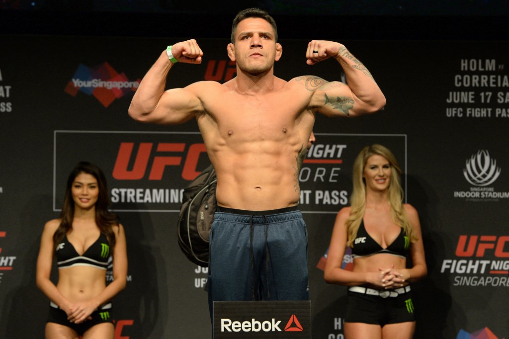 Rafael dos Anjos of Brazil stands on a weighing scale during the UFC Fight Night official weigh-in in Singapore as we look at the UFC Fight Night BetRivers promo.