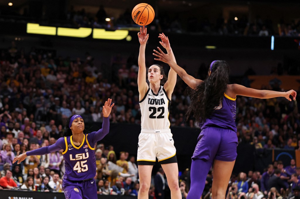 Caitlin Clark of the Iowa Hawkeyes shoots the ball against Angel Reese of the LSU Lady Tigers during the 2023 NCAA Women's Basketball Tournament final. The Hawkeyes and Tigers play a rematch as we offer our Caitlin Clark player props for LSU vs. Iowa.
