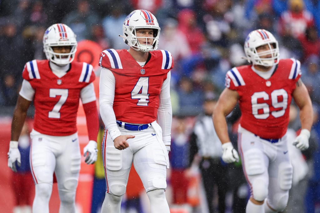 Bailey Zappe of the New England Patriots walks across the field in the second quarter against the Los Angeles Chargers, and we offer new U.S. bettors our exclusive BetRivers bonus code.