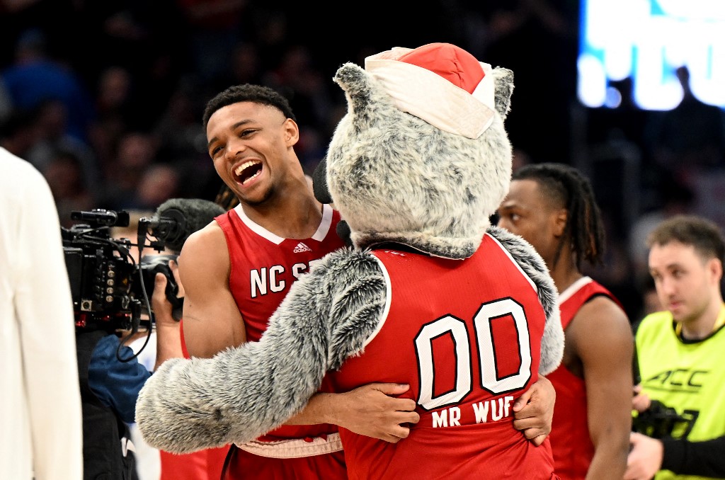 Casey Morsell #14 of the North Carolina State Wolfpack celebrates as we look at our Caesars North Carolina promo code