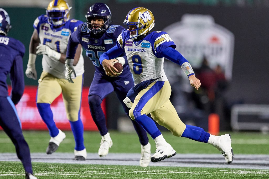 Zach Collaros of the Winnipeg Blue Bombers runs with the ball in the first half of the 109th Grey Cup game between the Toronto Argonauts and Winnipeg Blue Bombers at Mosaic Stadium. We look at the Blue Bombers in our Grey Cup Predictions.