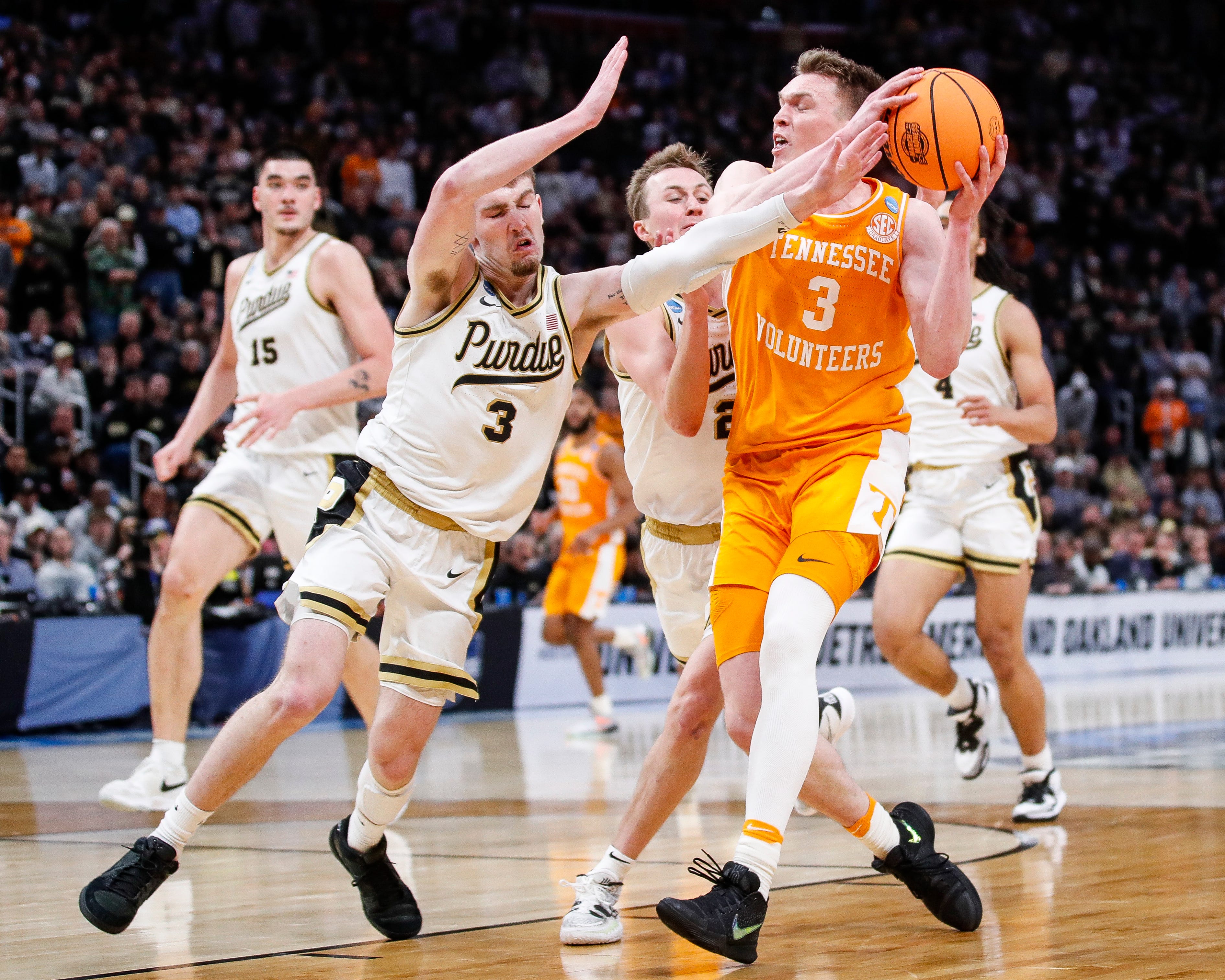 Tennessee guard Dalton Knecht makes a layup against Purdue guard Braden Smith during the second half of the NCAA tournament Elite 8 round at Little Caesars Arena in Detroit.  We look at Knecht in our NBA Draft Predictions.