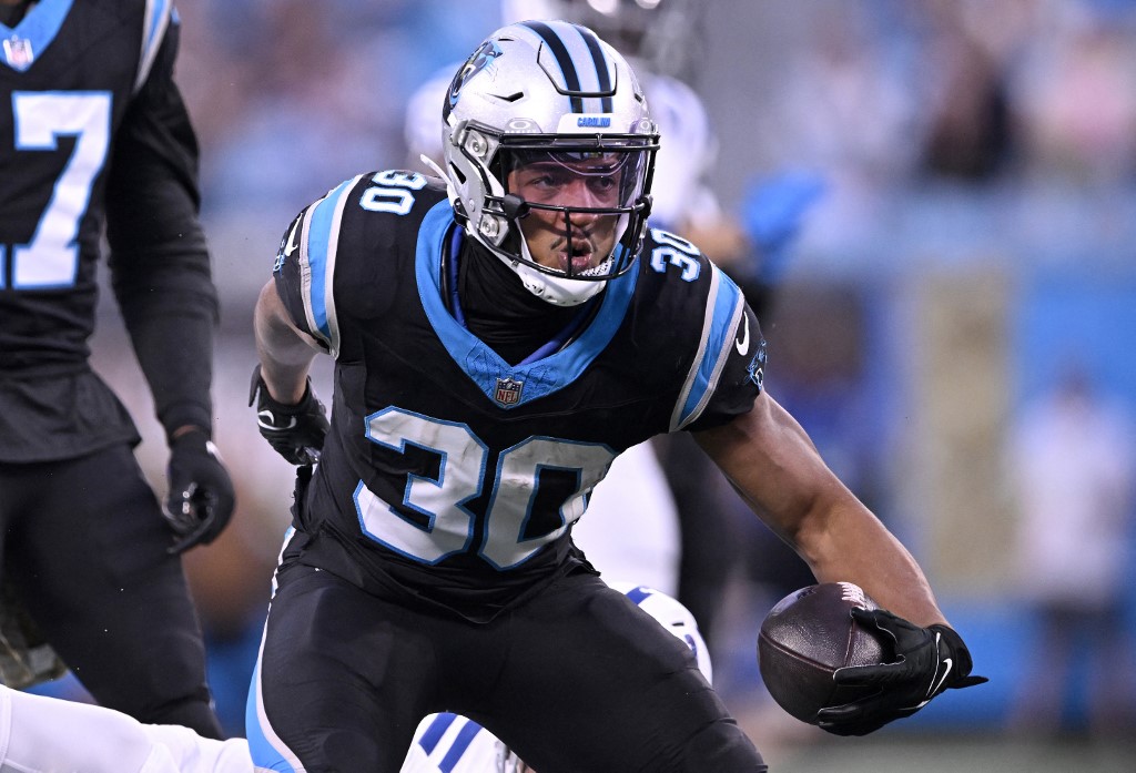 Chuba Hubbard of the Carolina Panthers celebrates a first down against the Indianapolis Colts, as we look at the latest ESPN BET and North Carolina news.