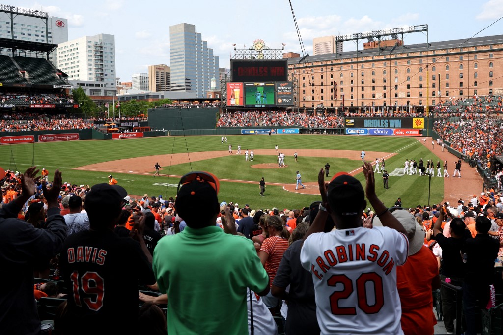 Fans cheer after the Baltimore Orioles defeated the Toronto Blue Jays at Oriole Park at Camden Yards.