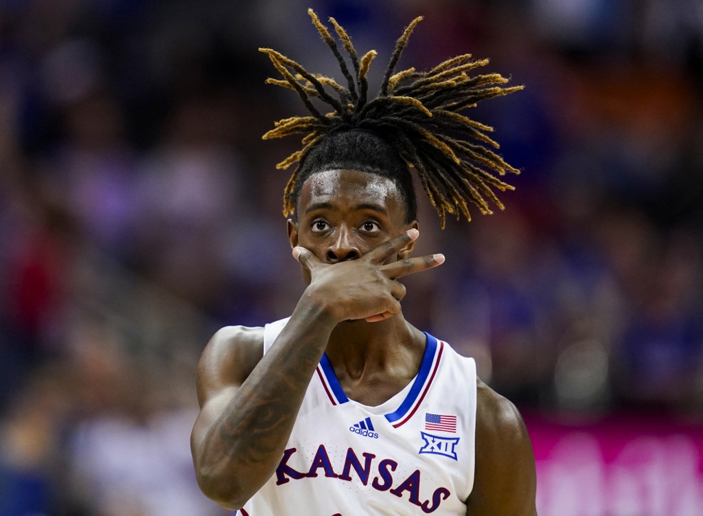 Jamari McDowell #11 of the Kansas Jayhawks celebrates after scoring as we look at our best Samford vs. Kansas March Madness prediction