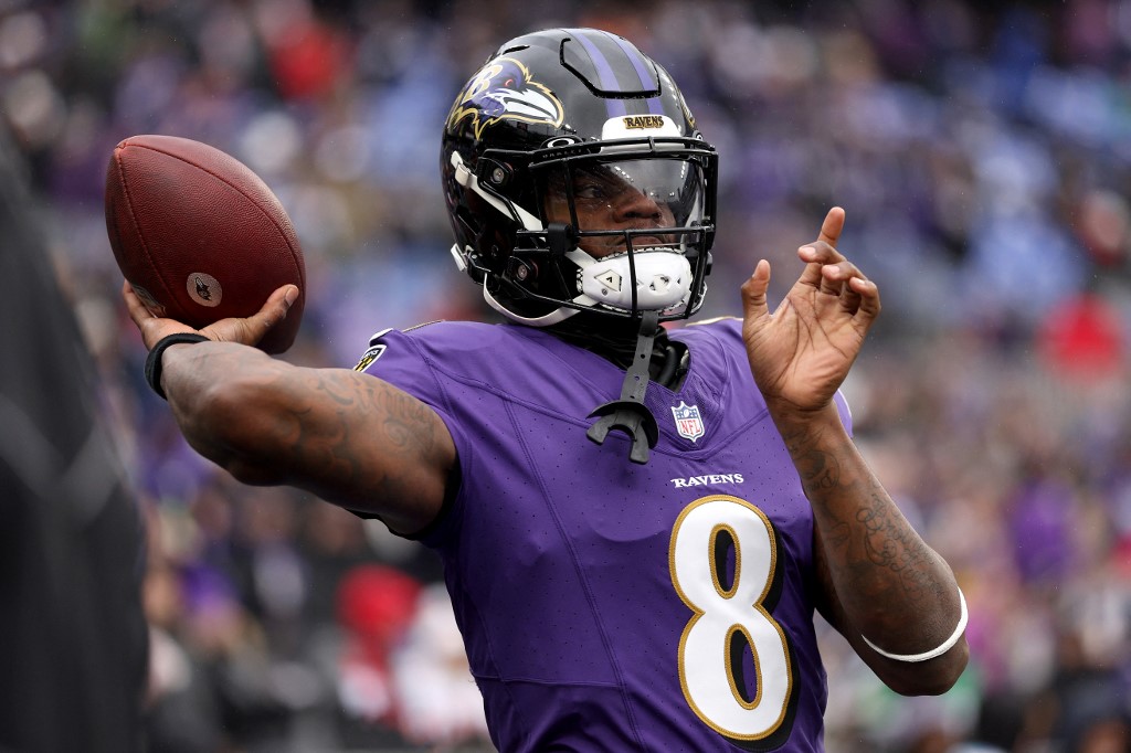 Lamar Jackson of the Baltimore Ravens warms up prior to the AFC Championship Game against the Kansas City Chiefs as we look at our 2024 NFL win total odds.