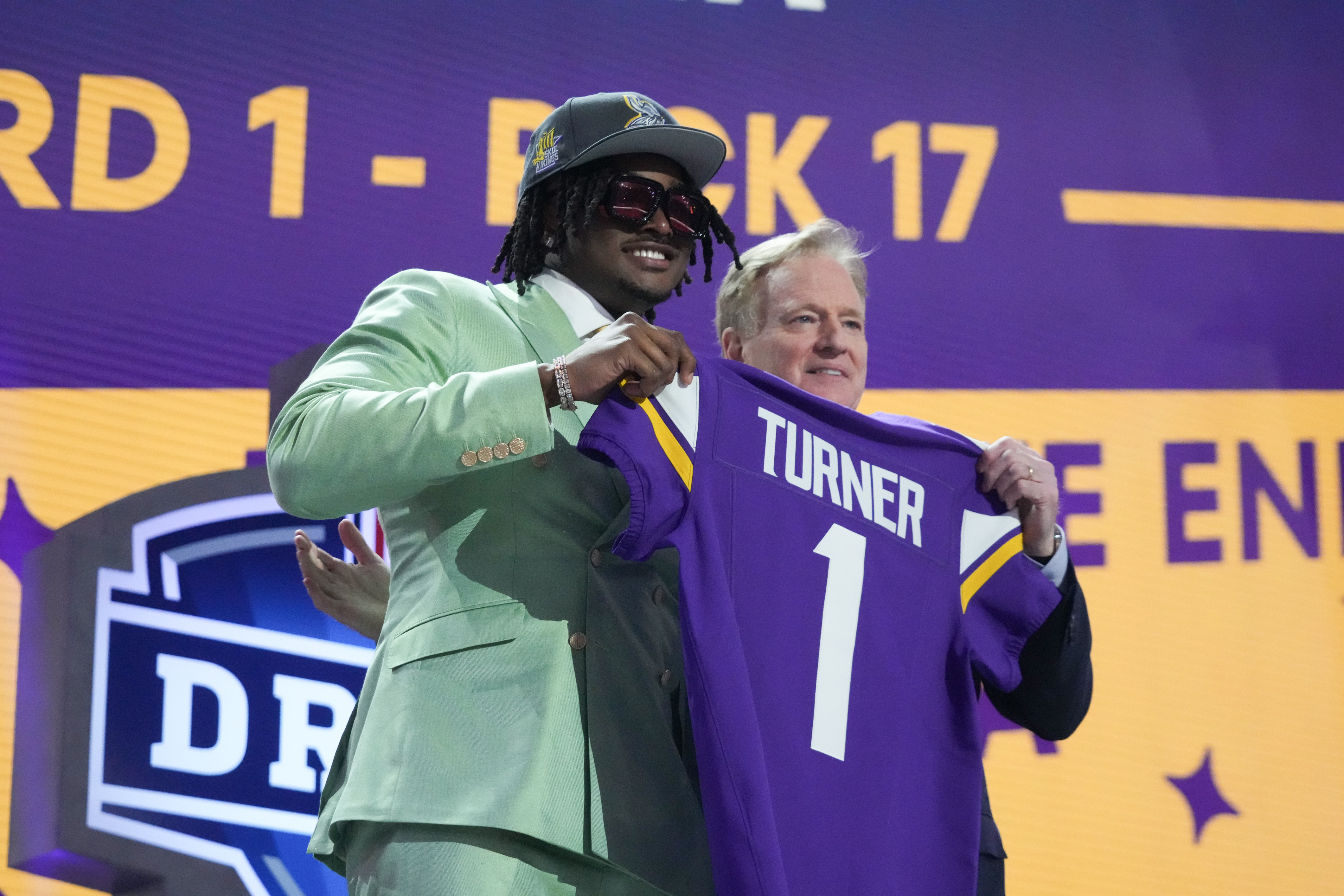 Alabama Crimson Tide linebacker Dallas Turner poses with NFL commissioner Roger Goodell after being selected by the Minnesota Vikings as the No. 17 pick in the first round of the 2024 NFL Draft. Turner leads the 2024-25 Defensive Rookie of the Year Odds.