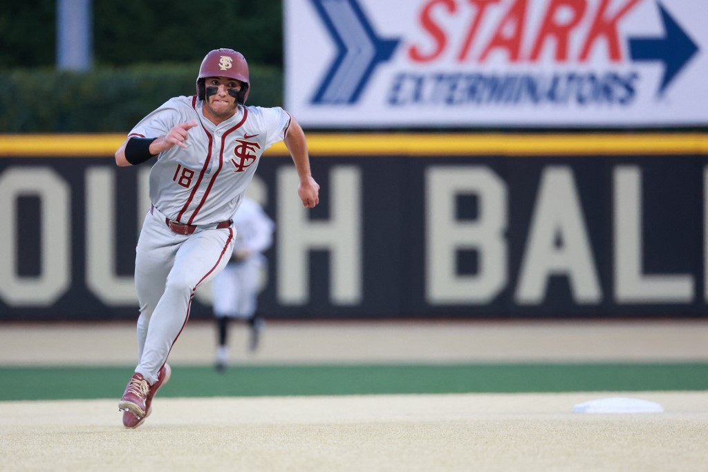 Max Williams of the Florida State Seminoles makes a run for third base as we look at the details of the Supreme Court listening to a challenge to current Florida sports betting laws.