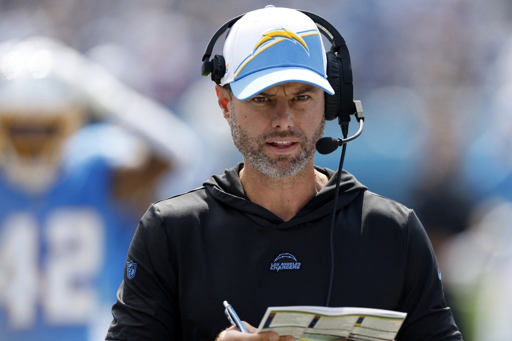 Head Coach Brandon Staley of the Los Angeles Chargers looks at his play call sheet during the first quarter against the Tennessee Titans, and we offer new U.S. bettors our exclusive bet365 bonus code for Bears vs. Chargers.