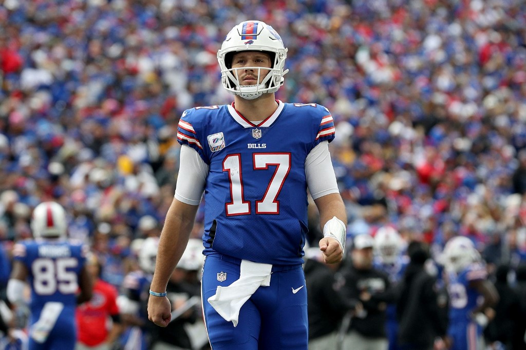 Josh Allen of the Buffalo Bills walks onto the field against the Pittsburgh Steelers, and we offer our top Josh Allen vs. Tua Tagovailoa player props for Week 18 based on the best NFL odds.