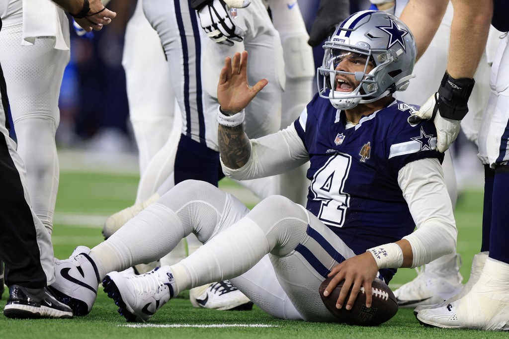 Dak Prescott #4 of the Dallas Cowboys reacts after being sacked as we take a look at the NFL Week 18 playoff scenarios and motivation at stake in the final week of the 2023 NFL regular season.