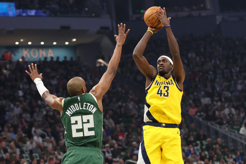 Pascal Siakam (43) of the Indiana Pacers shoots over Khris Middleton (22) of the Milwaukee Bucks, as we offer our best Bucks vs. Pacers player props for Game 3 on Friday.