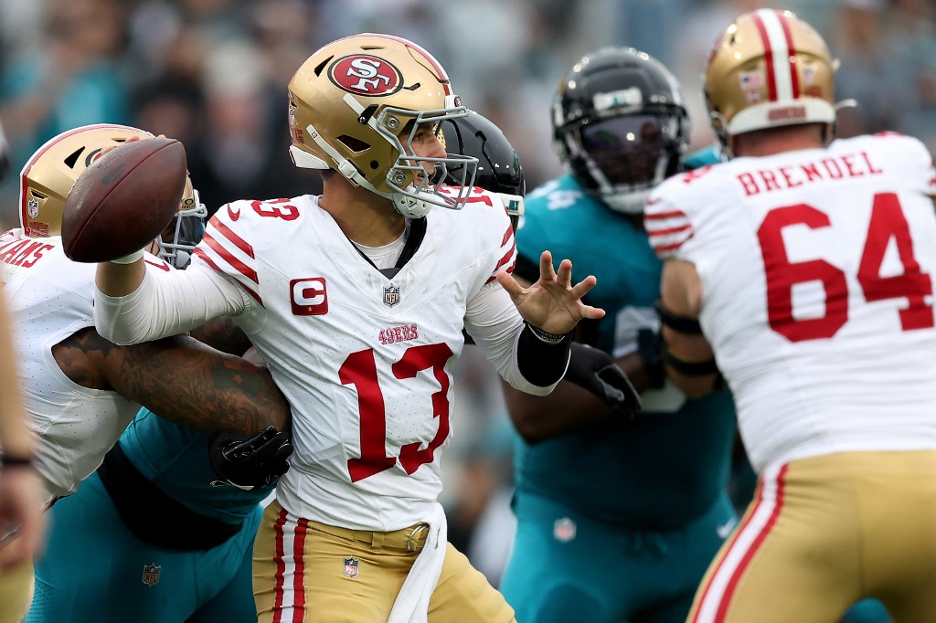 Brock Purdy of the San Francisco 49ers looks to pass as part of our Week 11 Buccaneers vs. 49ers NFL predictions