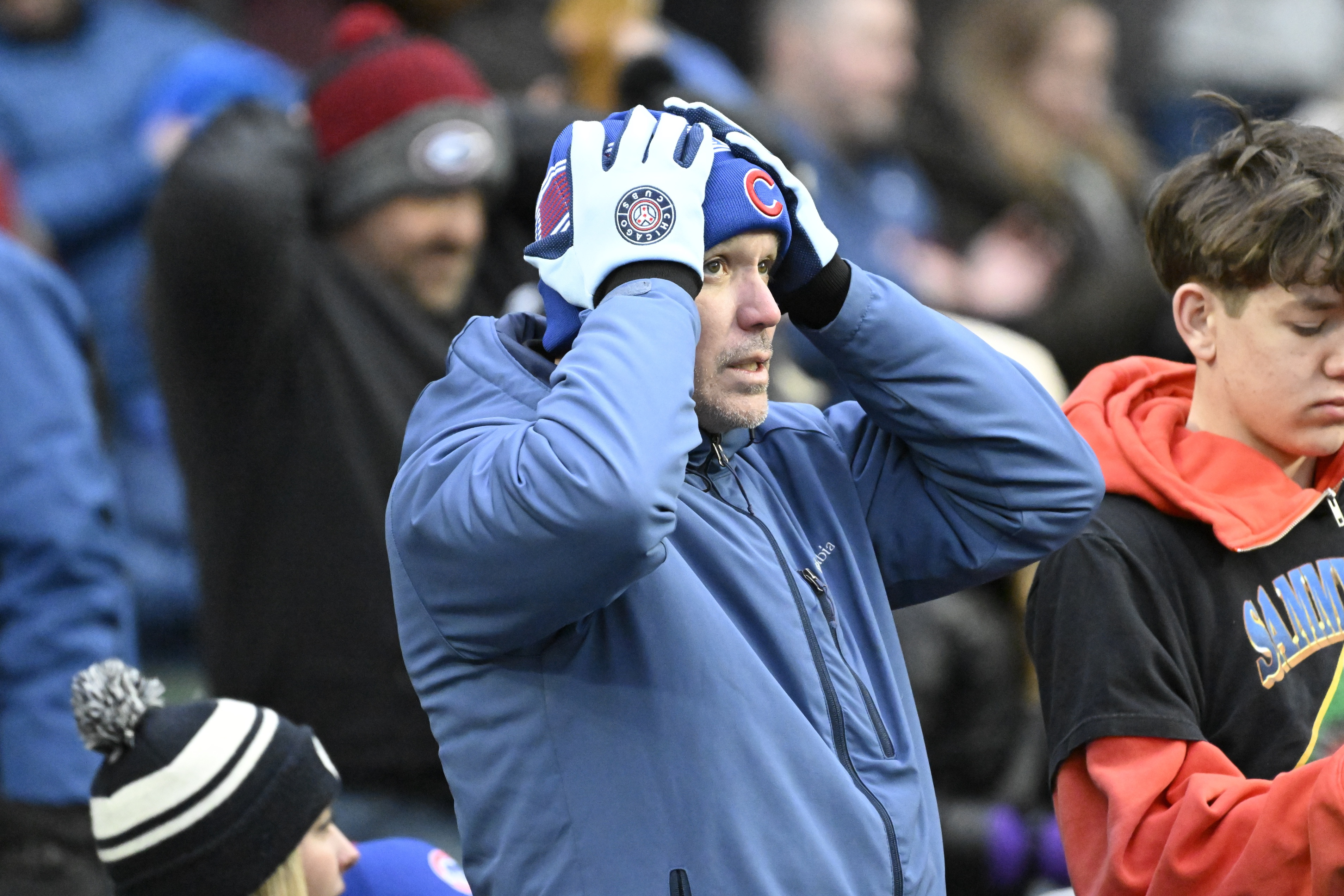 Chicago Cubs fan gets warm at Wrigley Field