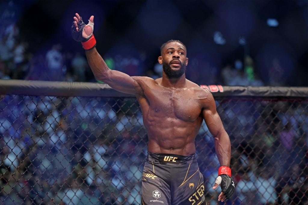Aljamain Sterling reacts after winning the bantamweight championship at the UFC event in Abu Dhabi, and we offer new U.S. bettors our exclusive BetRivers promo code for UFC 292.