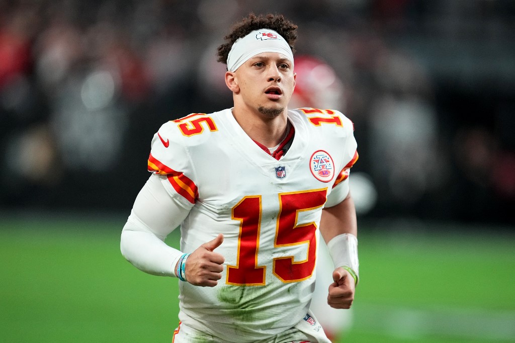 Patrick Mahomes of the Kansas City Chiefs runs off the field after the first half against the Las Vegas Raiders.