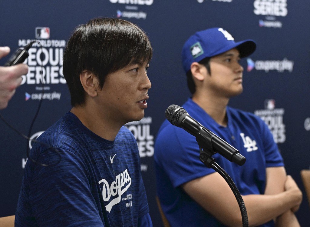 A file photo shows Shohei Ohtani, MLB Los Angeles Dodgers' Japanese baseball player, and his interpreter Ippei Mizuhara attending a press conference for the MLB opening game as we look at Mizuhara pleading guilty.