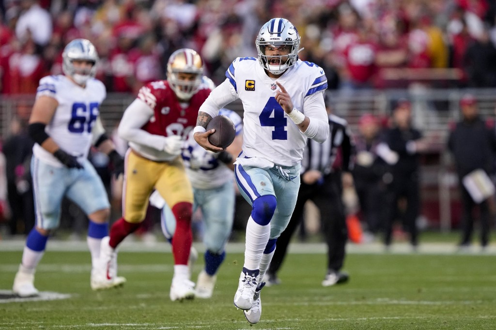 Dak Prescott of the Dallas Cowboys carries the ball as we look at his player props for Seahawks vs. Cowboys in TNF Week 13.