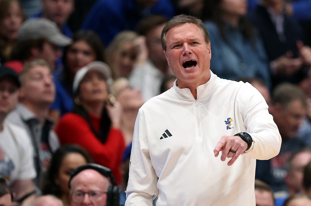 Head coach Bill Self of the Kansas Jayhawks coaches from the bench as we share our best Cincinnati vs. Kansas prediction.