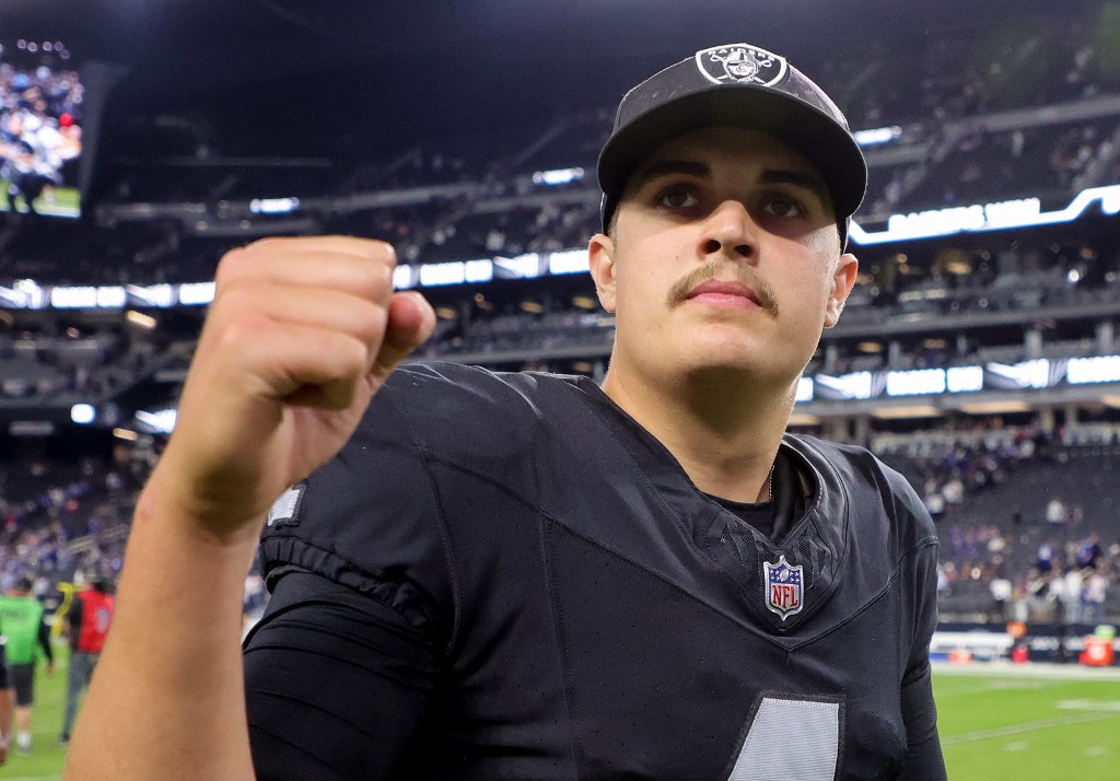 Quarterback Aidan O'Connell of the Las Vegas Raiders gestures as he walks off the field after the team's 30-6 victory over the New York Giants as we look at our Jets-Raiders prediction.