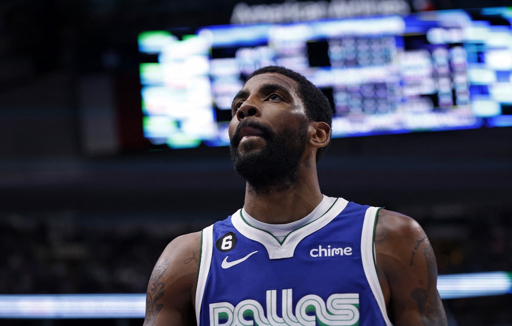 Dallas Mavericks guard Kyrie Irving looks upward from the middle of the court as we look at the NBA Finals MVP odds and predictions.