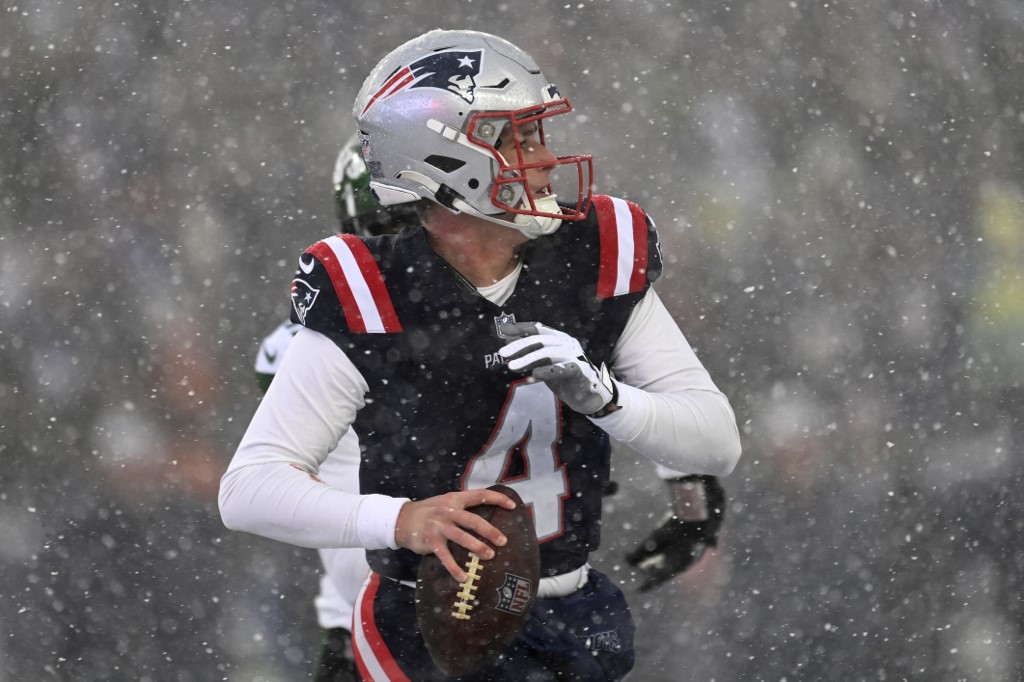 Bailey Zappe of the New England Patriots looks to throw during a game against the New York Jets. Bally Bet remains coy on launch date in Massachusetts.