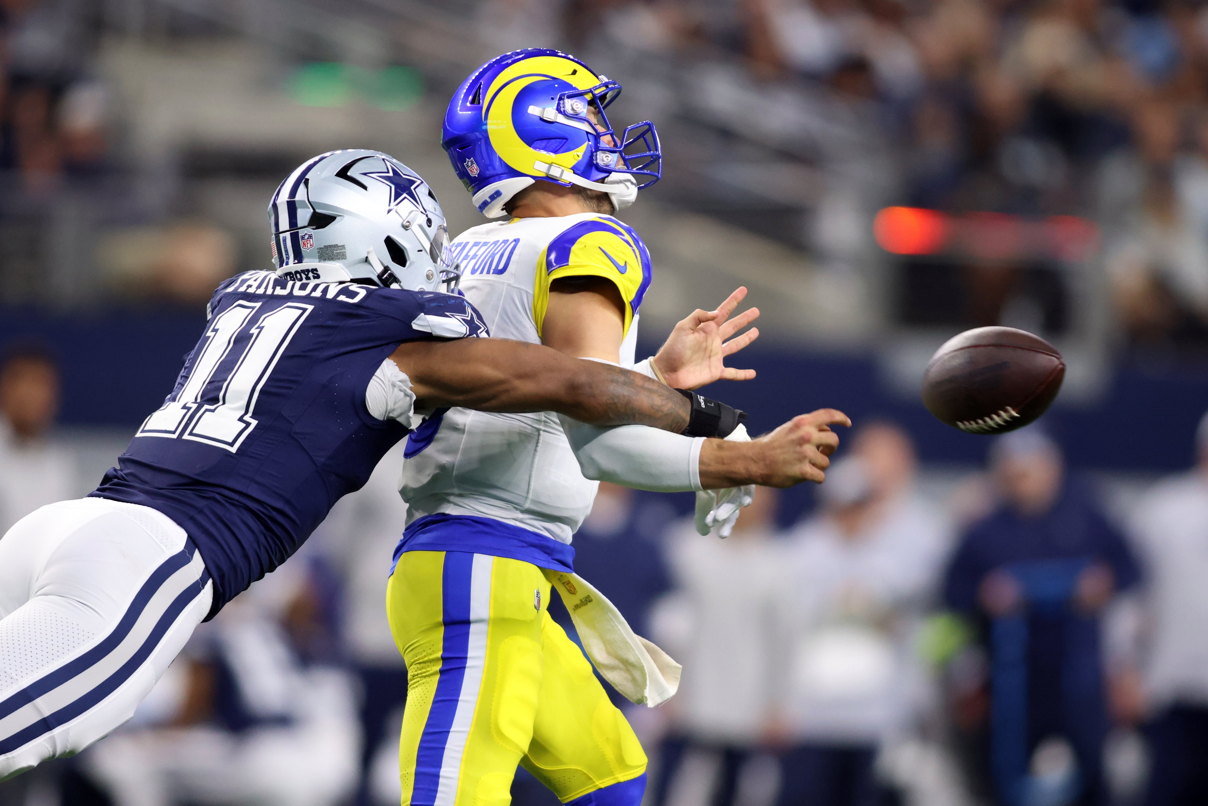 Dallas Cowboys linebacker Micah Parsons hits Los Angeles Rams quarterback Matthew Stafford in the second quarter at AT&T Stadium. Parsons leads the 2024-25 NFL Defensive Player of the Year Odds.