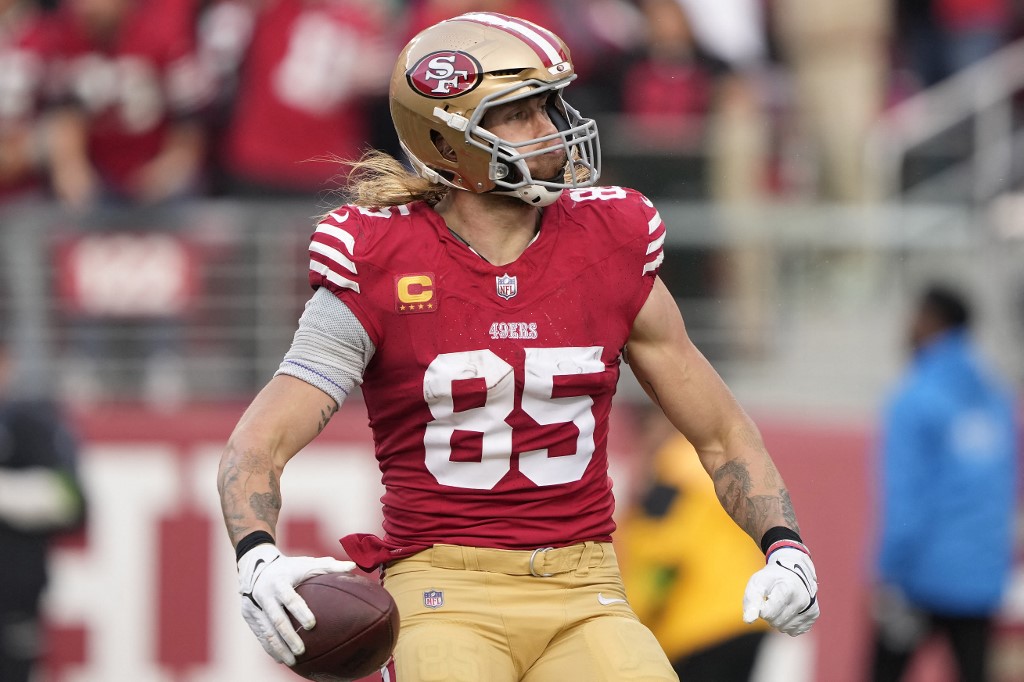 San Francisco 49ers George Kittle celebrates a touchdown as we look at the Super Bowl injury report and track the latest injury updates and betting odds for Chiefs vs. 49ers in Super Bowl 58.